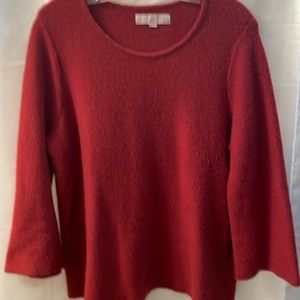 Cozy reddish/ rust colored sweater. Gently used
